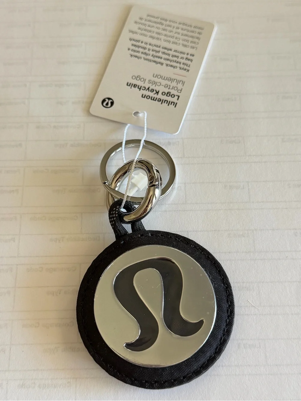 Lululemon Round Logo Keychain in Black and Silver